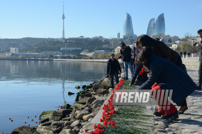 Baku residents bringing flowers to Seaside Boulevard to honor missing oil workers.  Azerbaijan, Dec.07, 2015